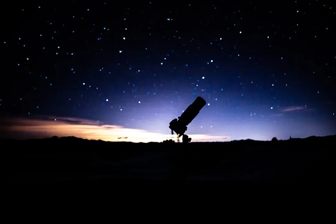 guests stargazing at night with a telescope