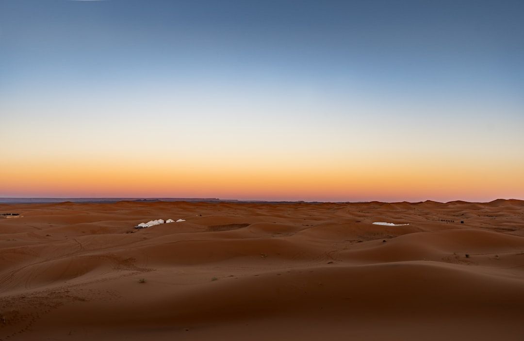 camel trek morocco sunset dunes